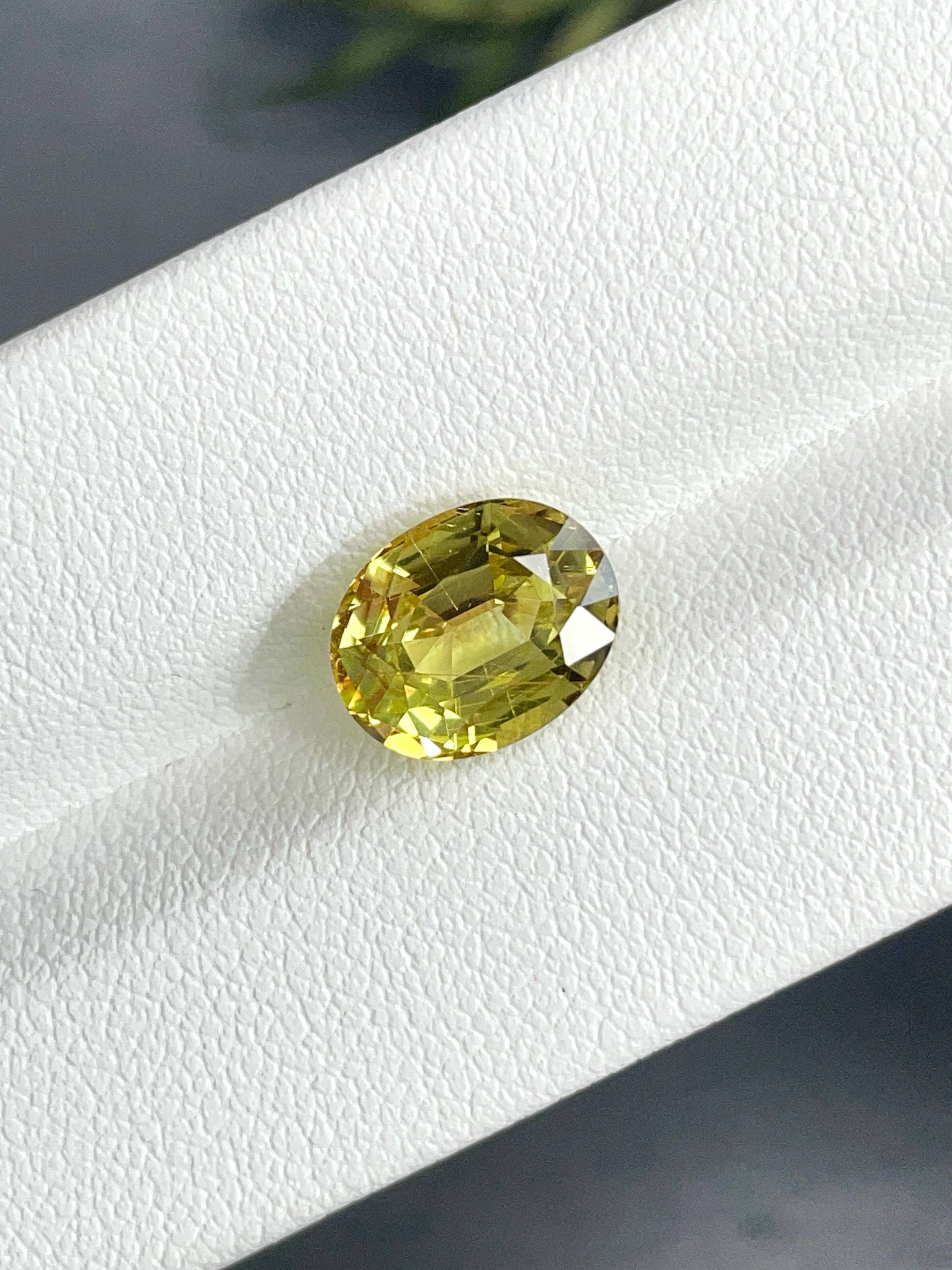 lemon yellow chrysoberyl, 3.99ct oval cut — view 5