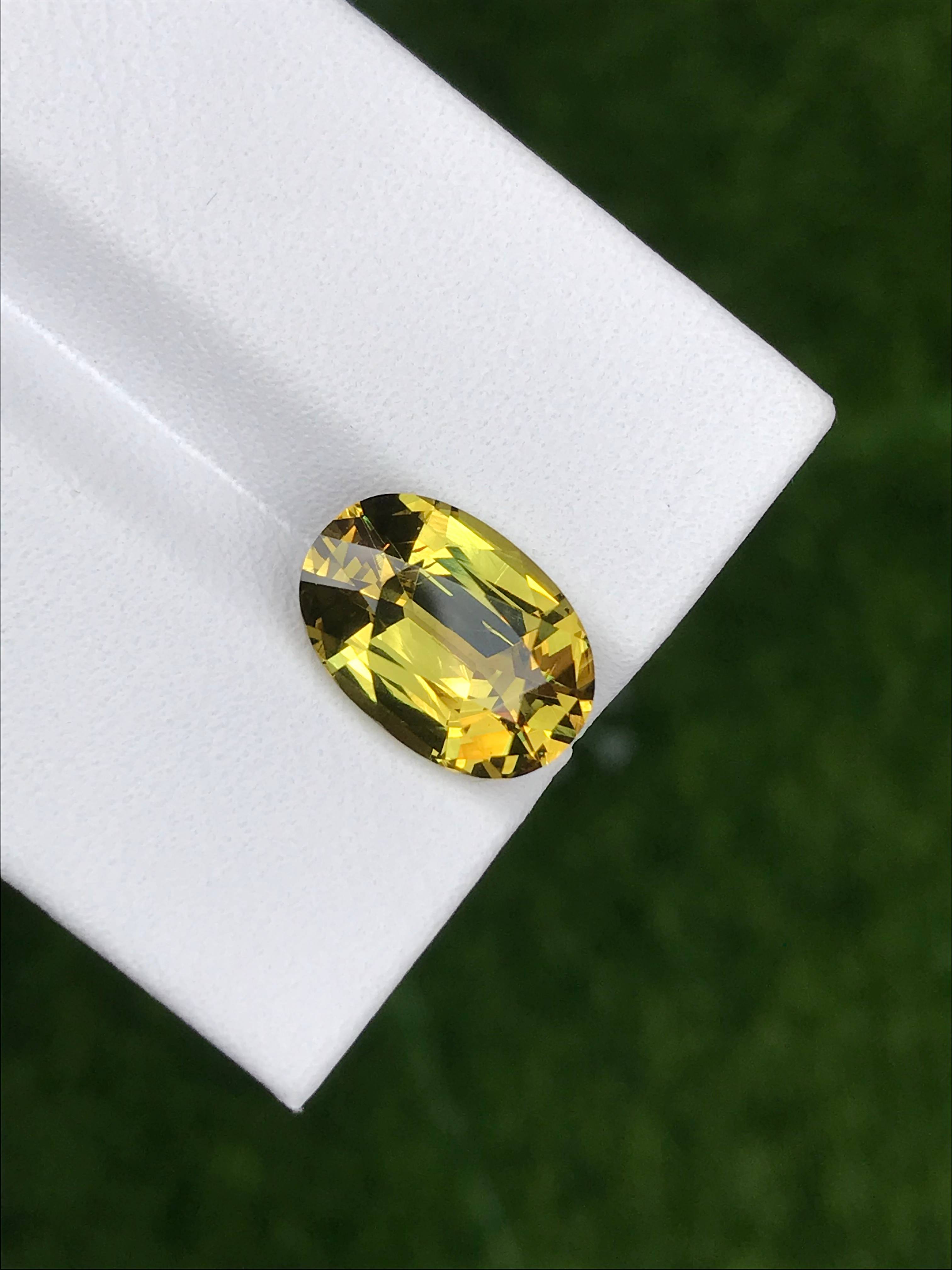 lemon yellow grossular garnet, 4.42ct oval cut — view 5