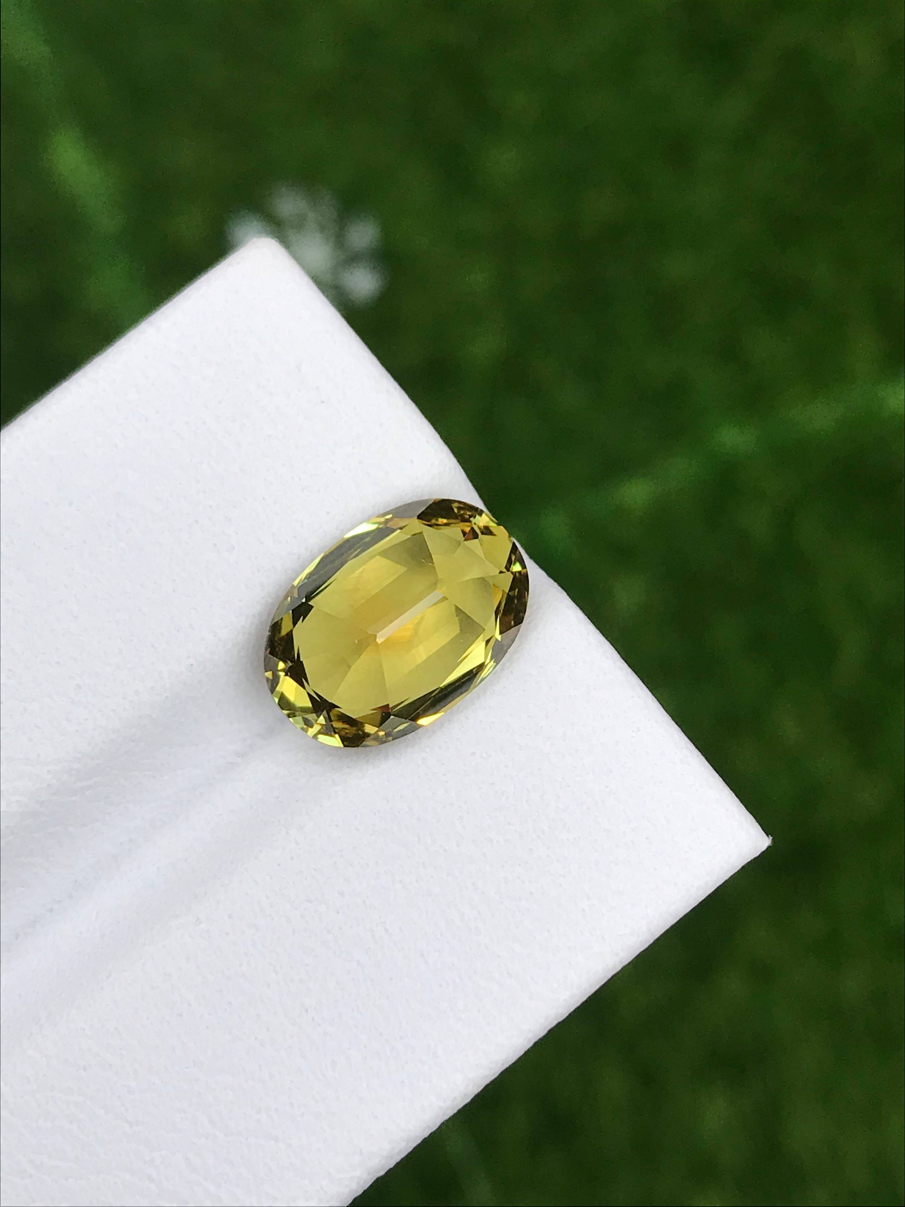 lemon yellow grossular garnet, 4.42ct oval cut — view 7