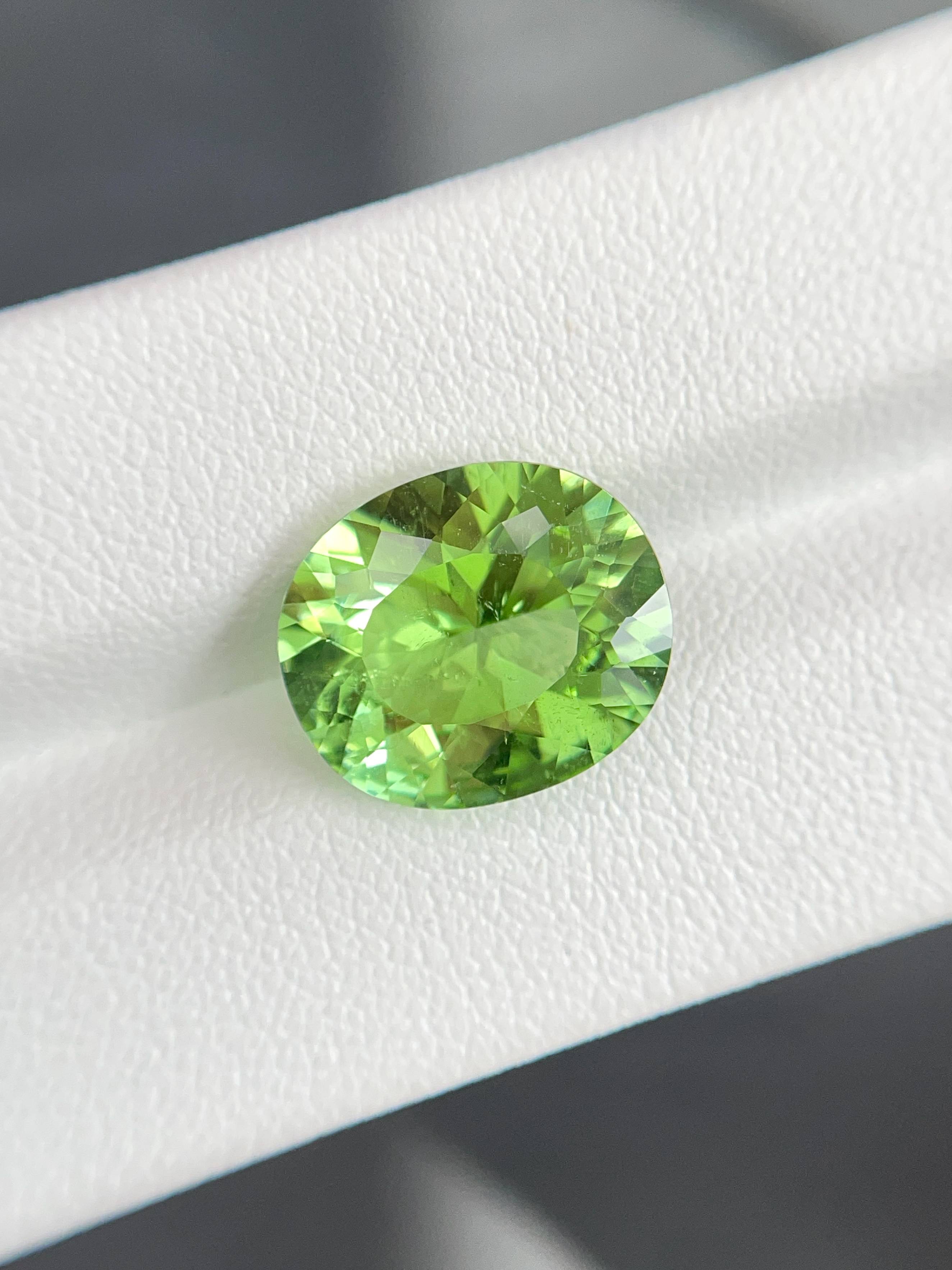 green paraiba tourmaline, 6.82ct oval cut — view 5
