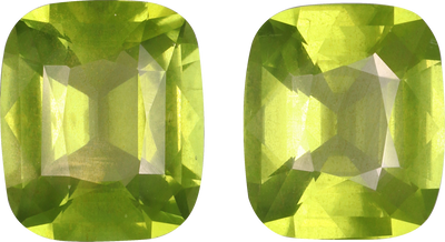 Cushion cut peridot, 10.7 by 9.1 mm, shown at actual size