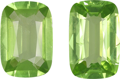 Cushion cut peridot, 12.1 by 7.9 mm, shown at actual size