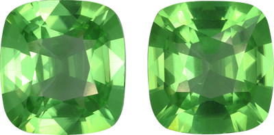 Cushion cut peridot, 12.79 by 11.96 mm, shown at actual size