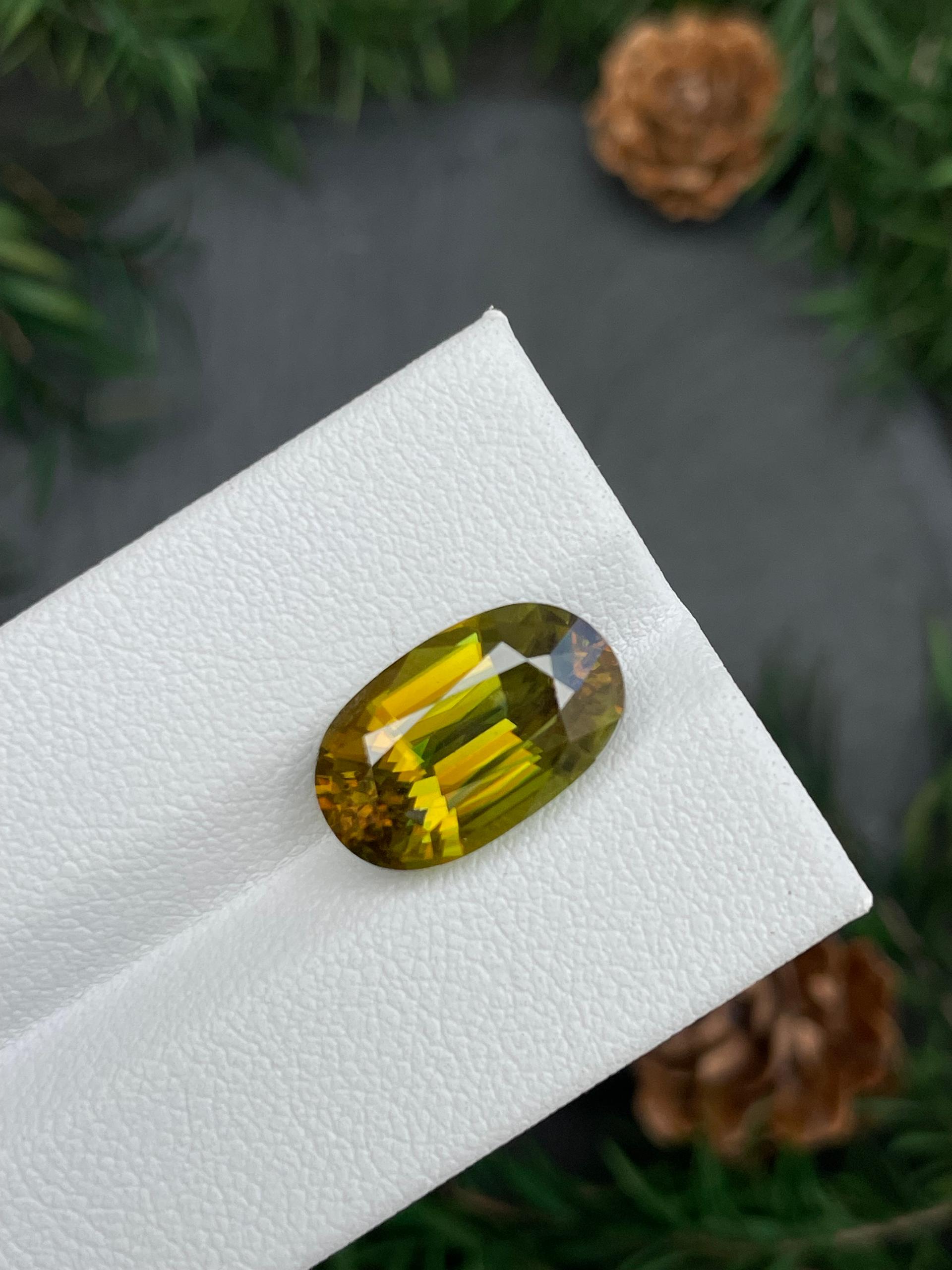 olive green sphene, 7.44ct oval cut — view 5