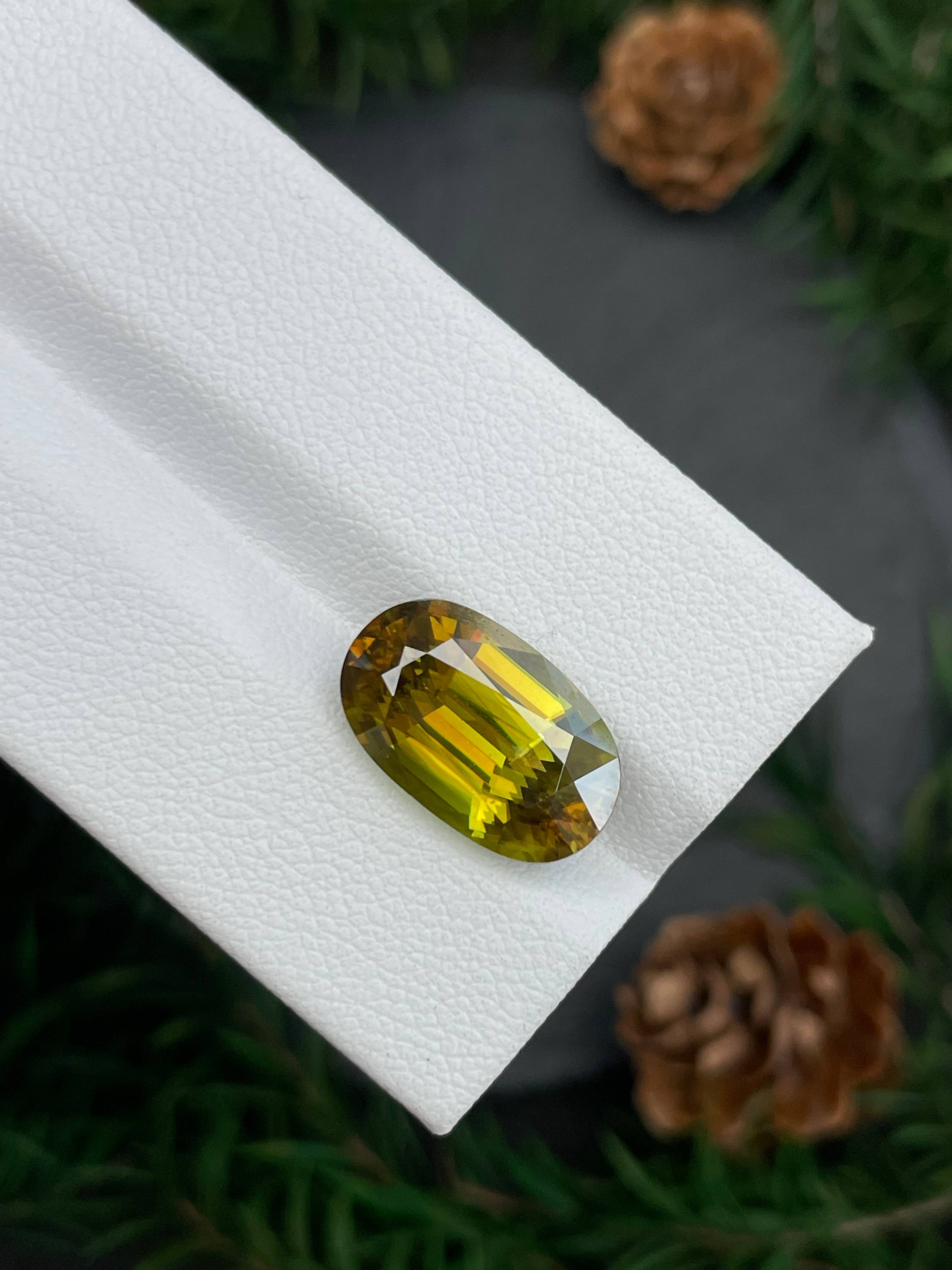olive green sphene, 7.44ct oval cut — view 6