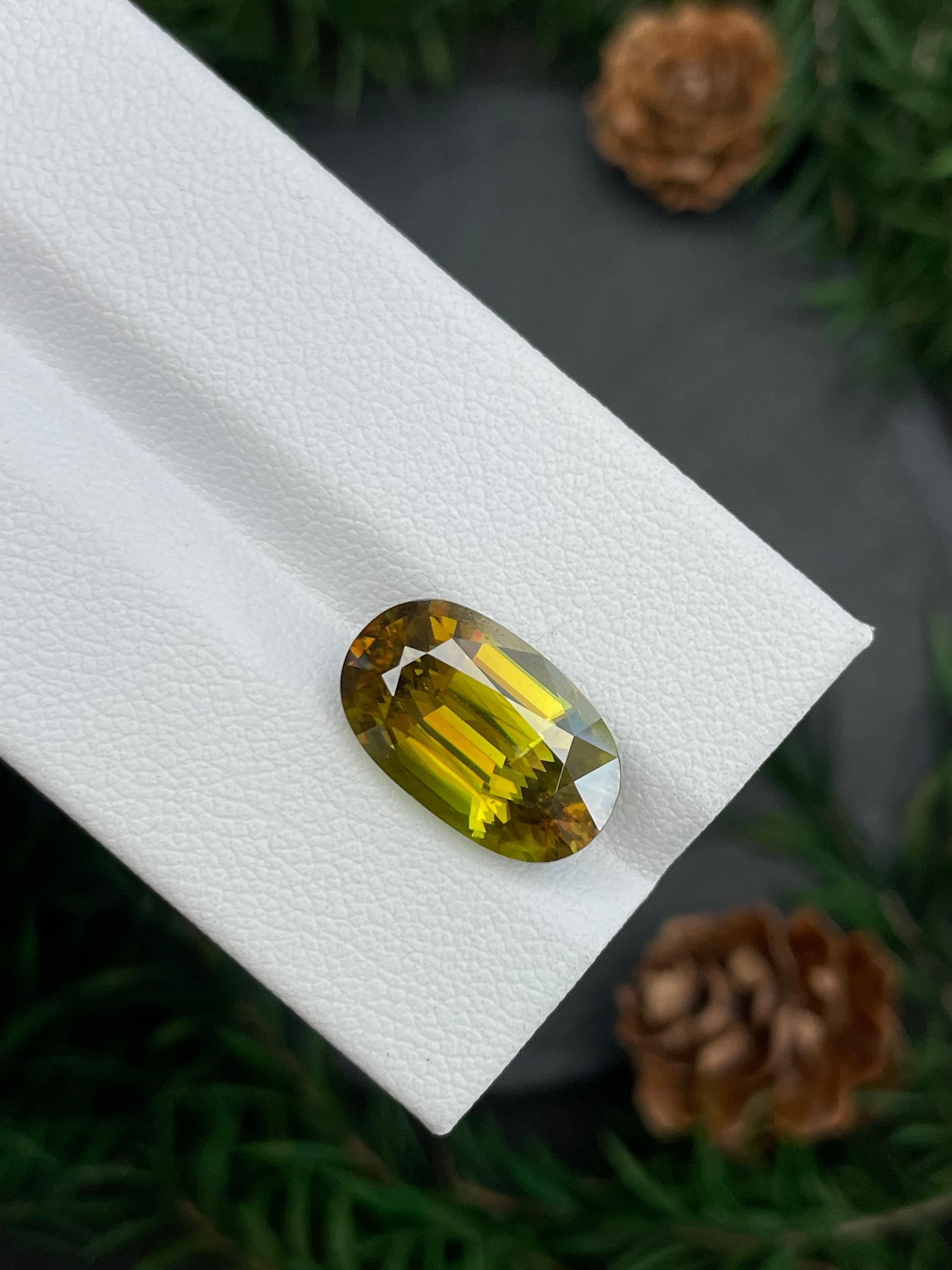 olive green sphene, 7.44ct oval cut — view 6