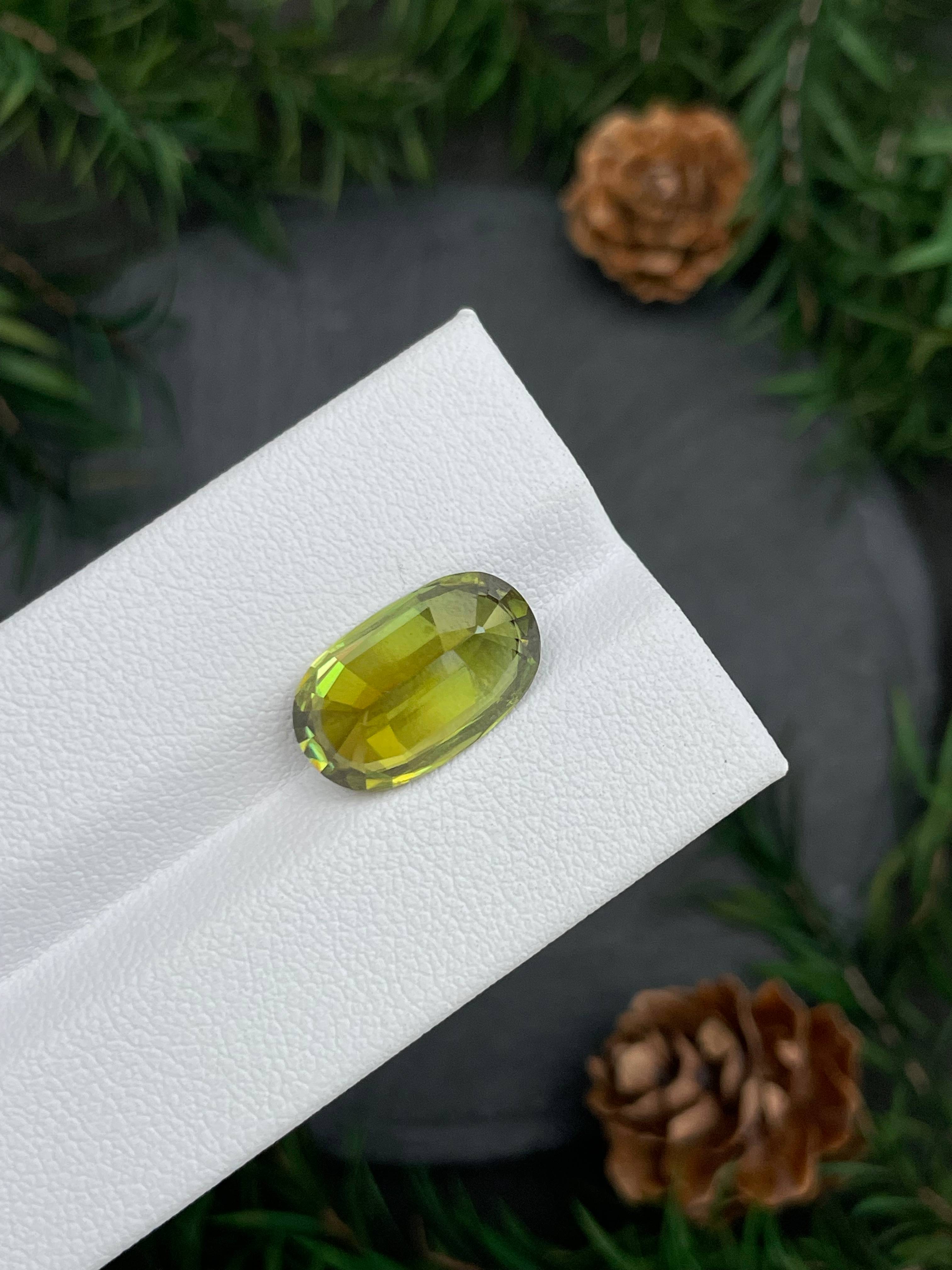 olive green sphene, 7.44ct oval cut — view 7