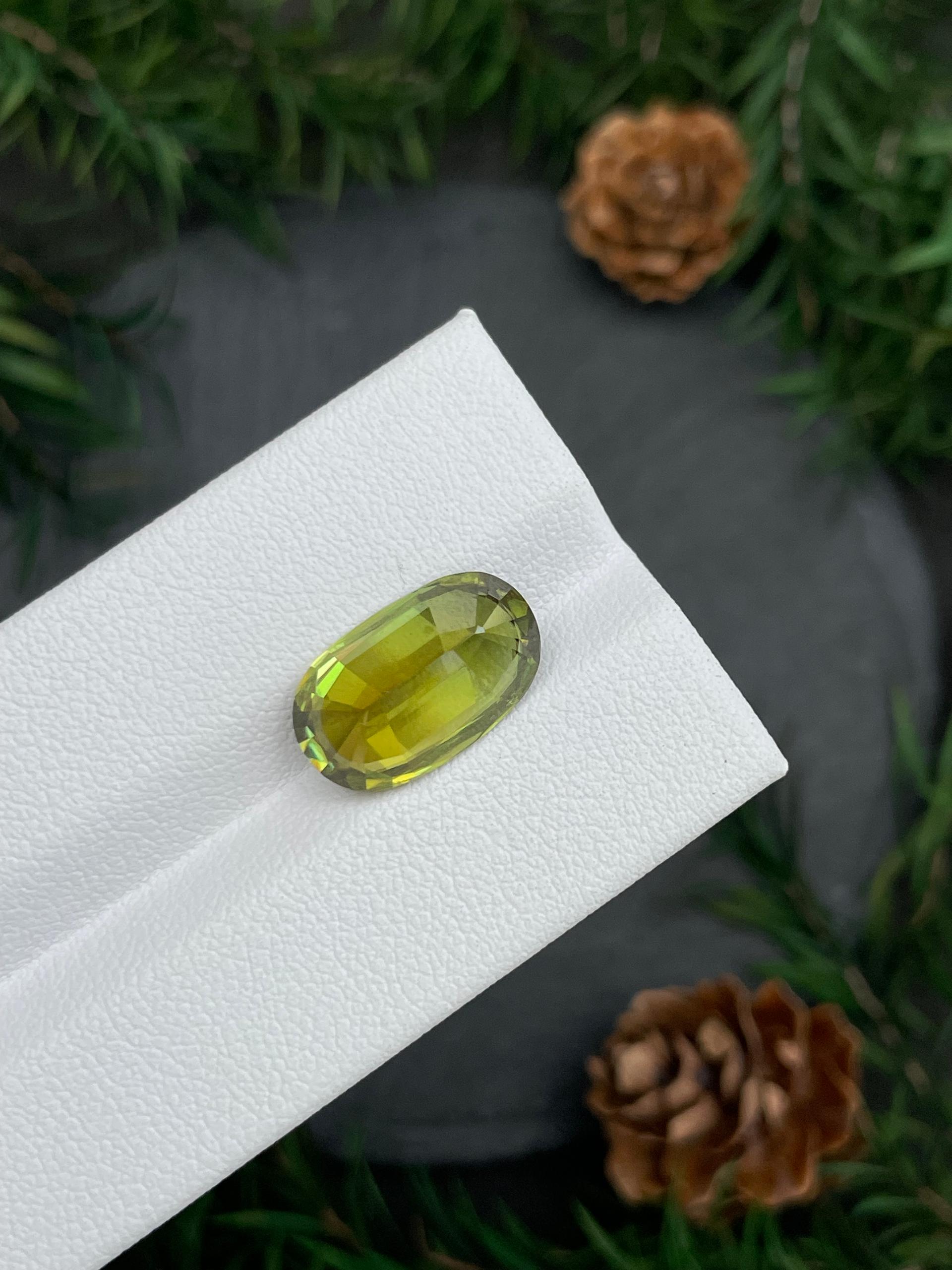 olive green sphene, 7.44ct oval cut — view 7