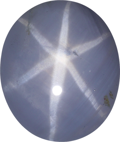 Oval cut star sapphire, 7.6 by 6.45 mm, shown at actual size