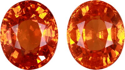Oval cut spessartite garnet, 12.07 by 10.08 mm, shown at actual size
