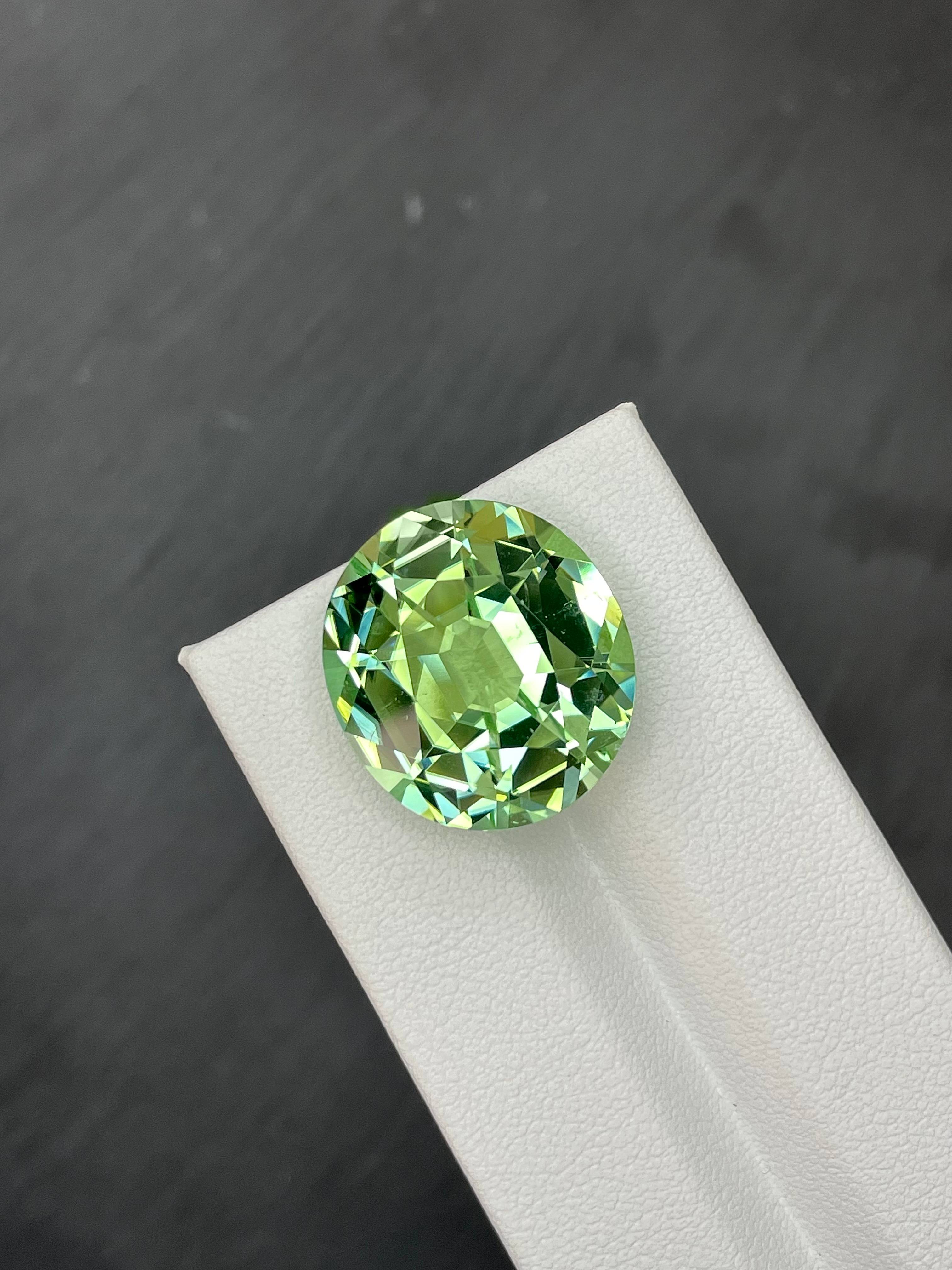 pistachio green green tourmaline, 21.91ct oval cut — view 5