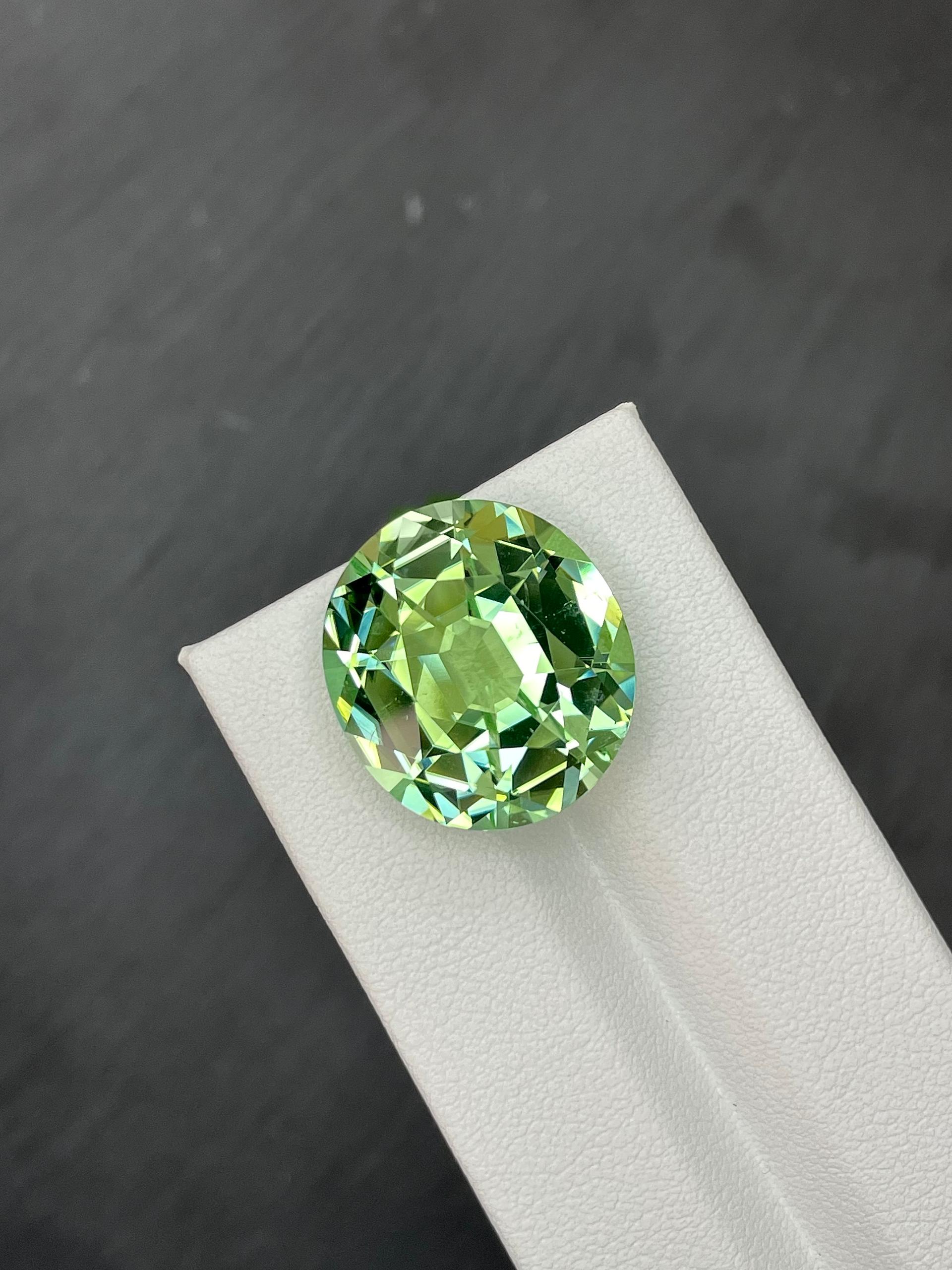 pistachio green green tourmaline, 21.91ct oval cut — view 5