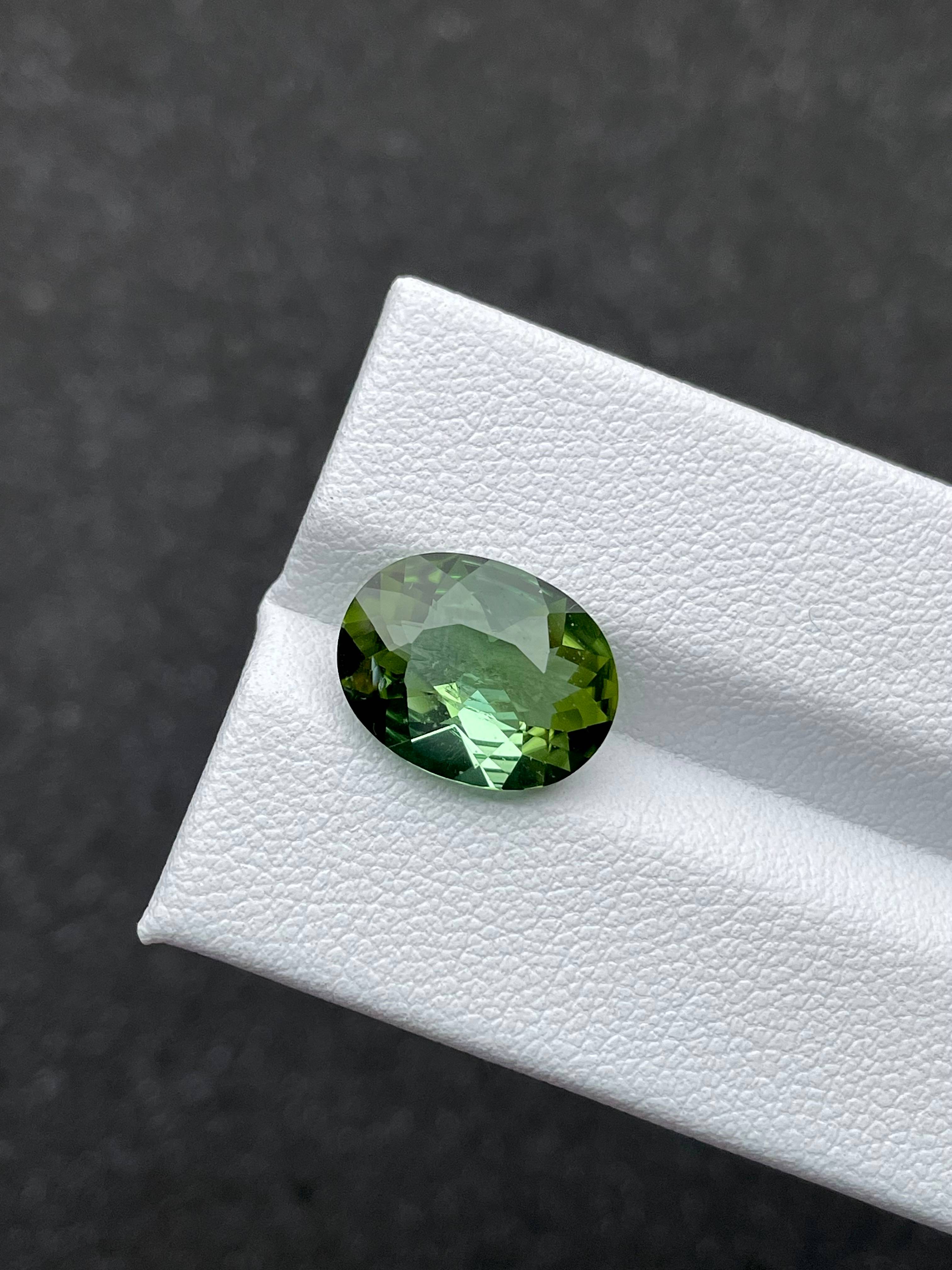 pistachio green green tourmaline, 4.55ct oval cut — view 5