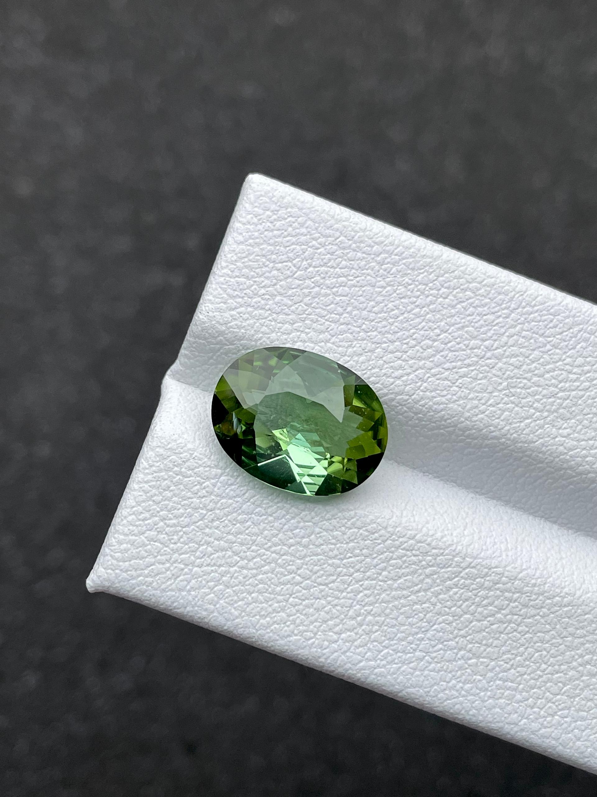 pistachio green green tourmaline, 4.55ct oval cut — view 5