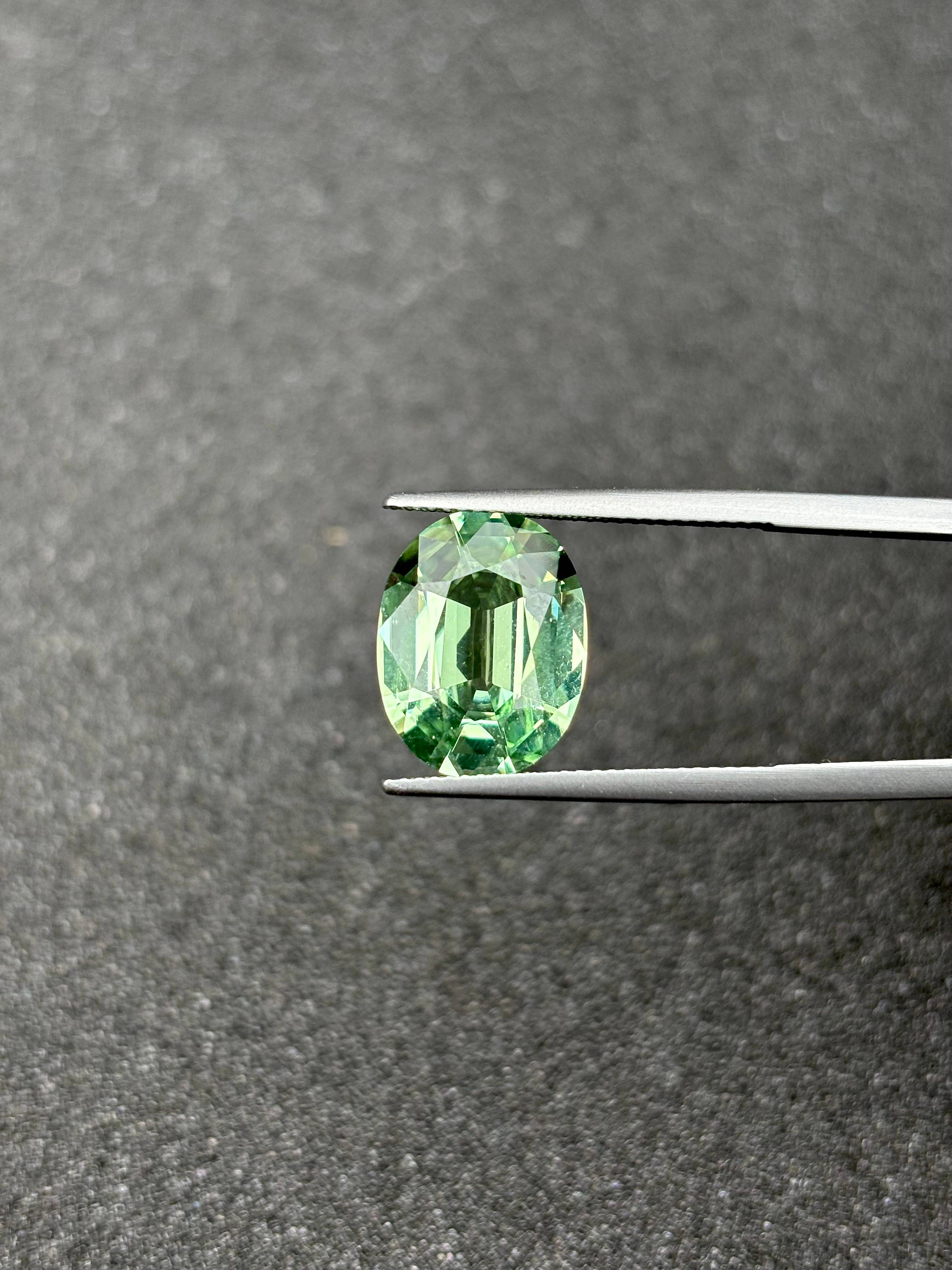 lime green green tourmaline, 6.72ct oval cut — view 5