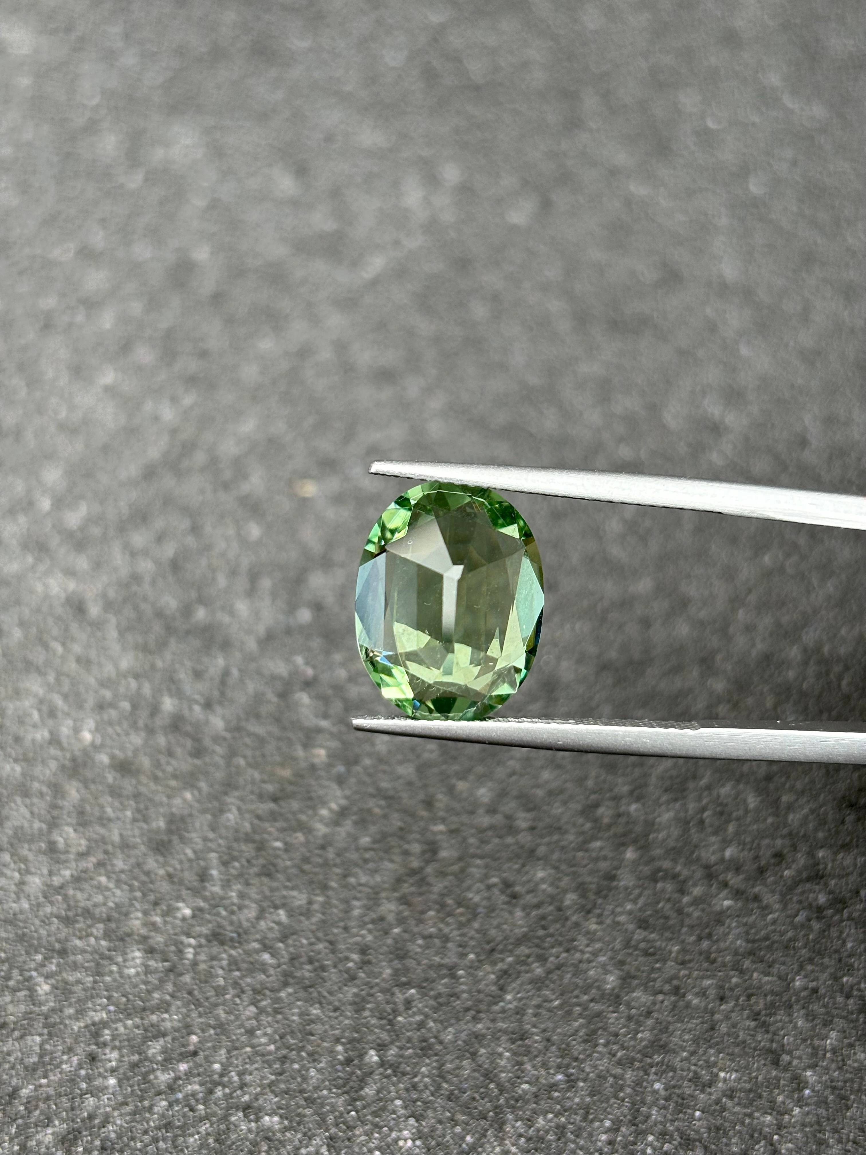 lime green green tourmaline, 6.72ct oval cut — view 6