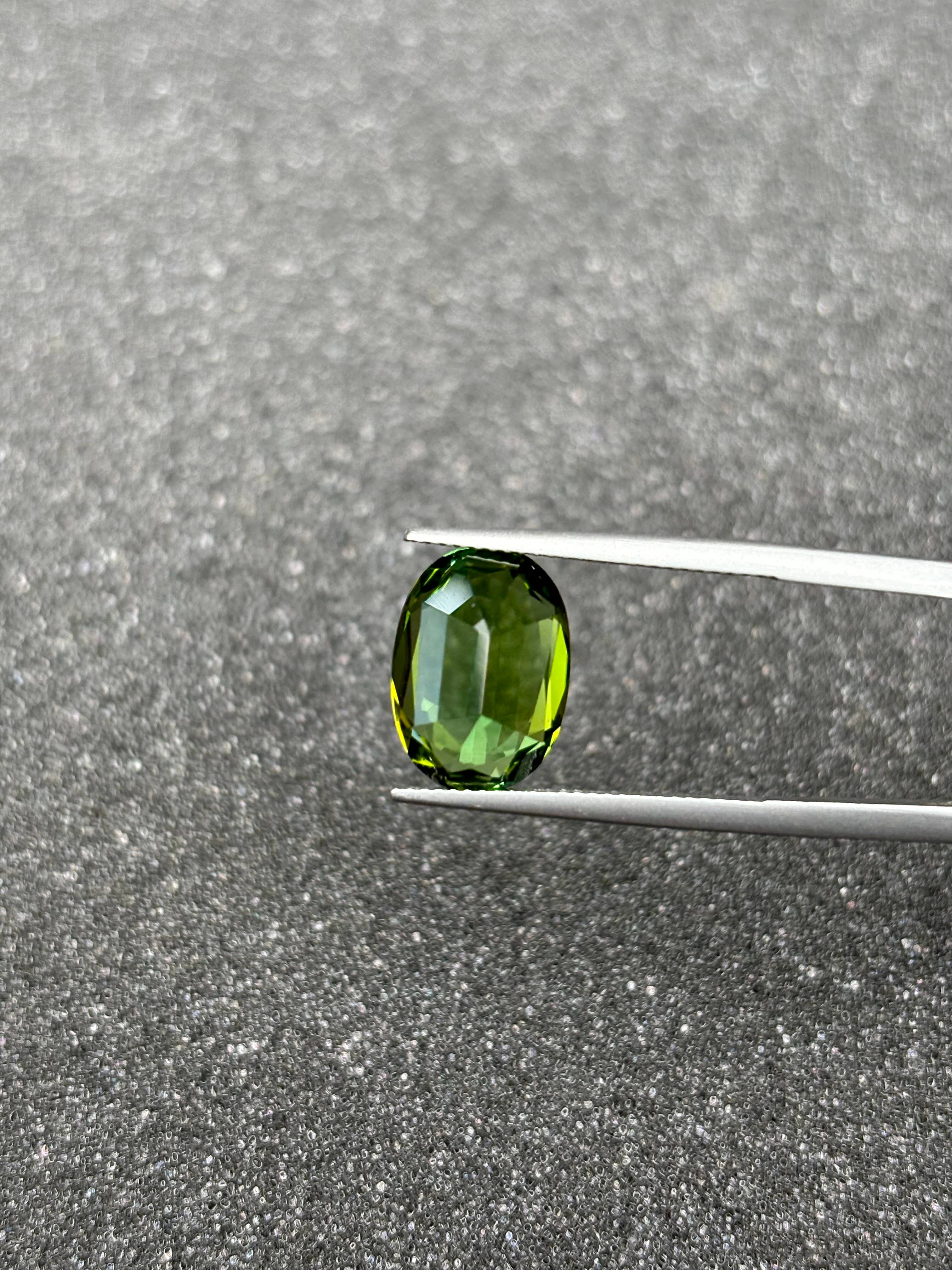 lime green green tourmaline, 6.09ct oval cut — view 6