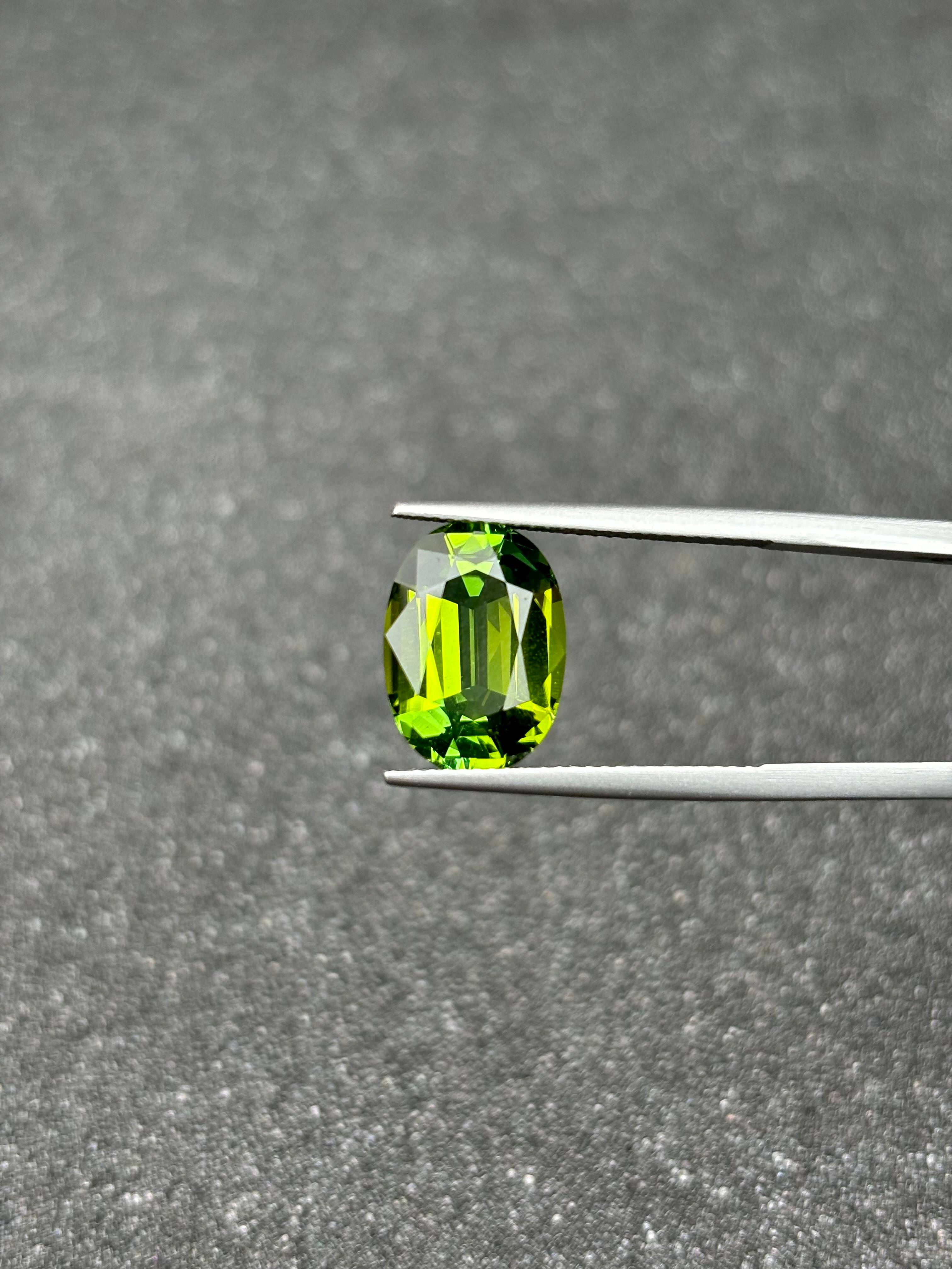 lime green green tourmaline, 6.09ct oval cut — view 7