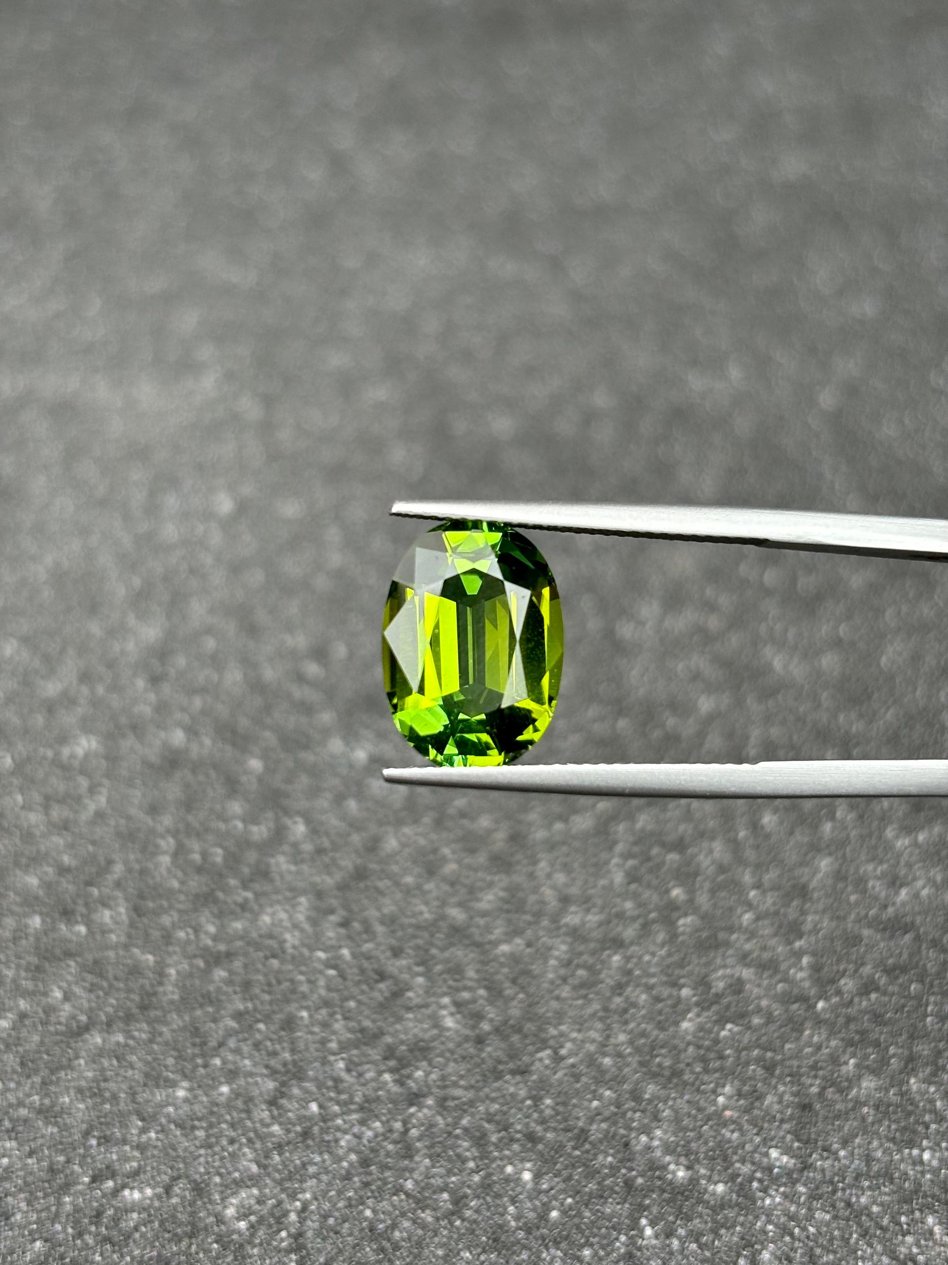 lime green green tourmaline, 6.09ct oval cut — view 7