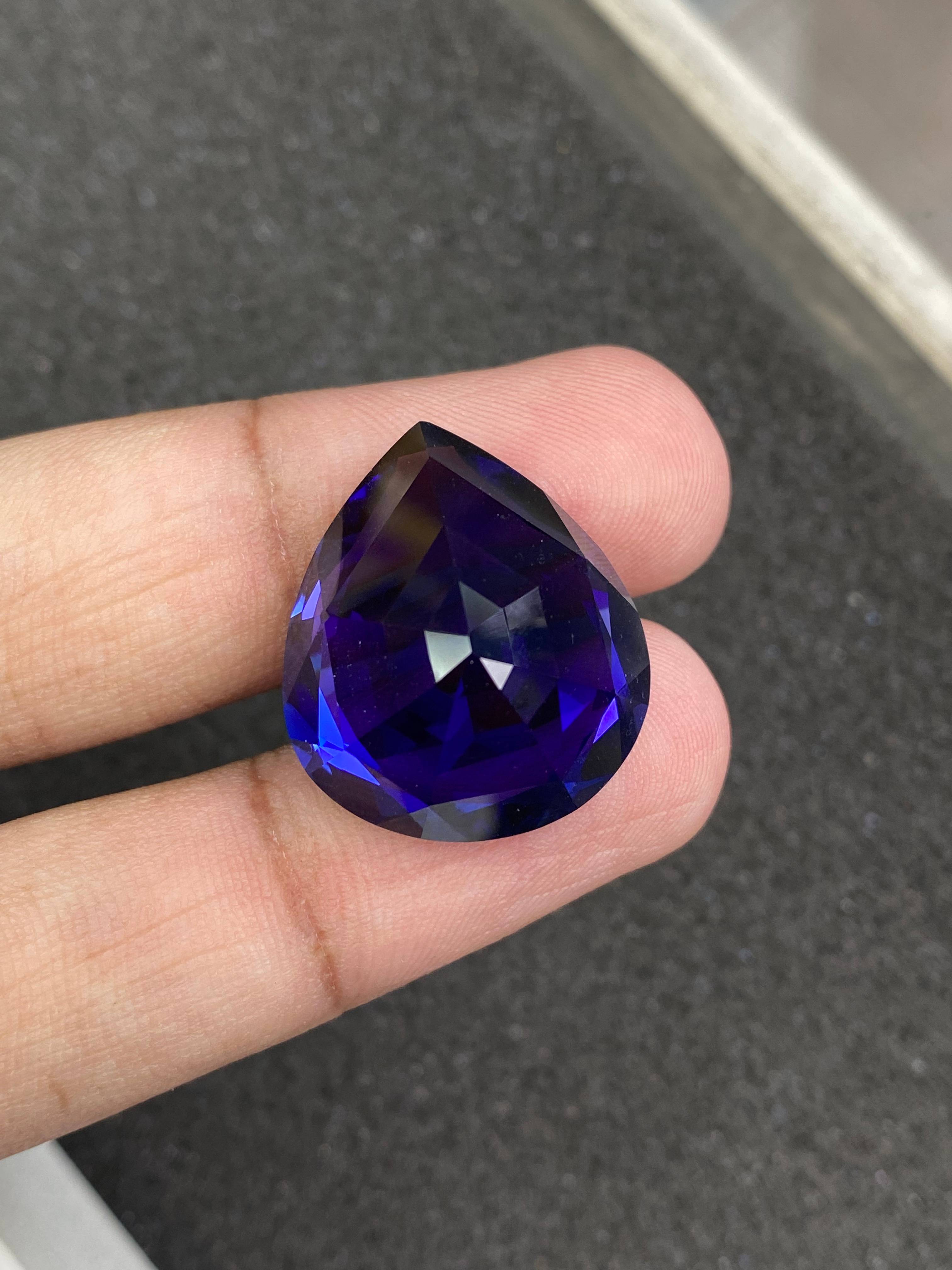 blue tanzanite, 38.12ct pear cut — view 6