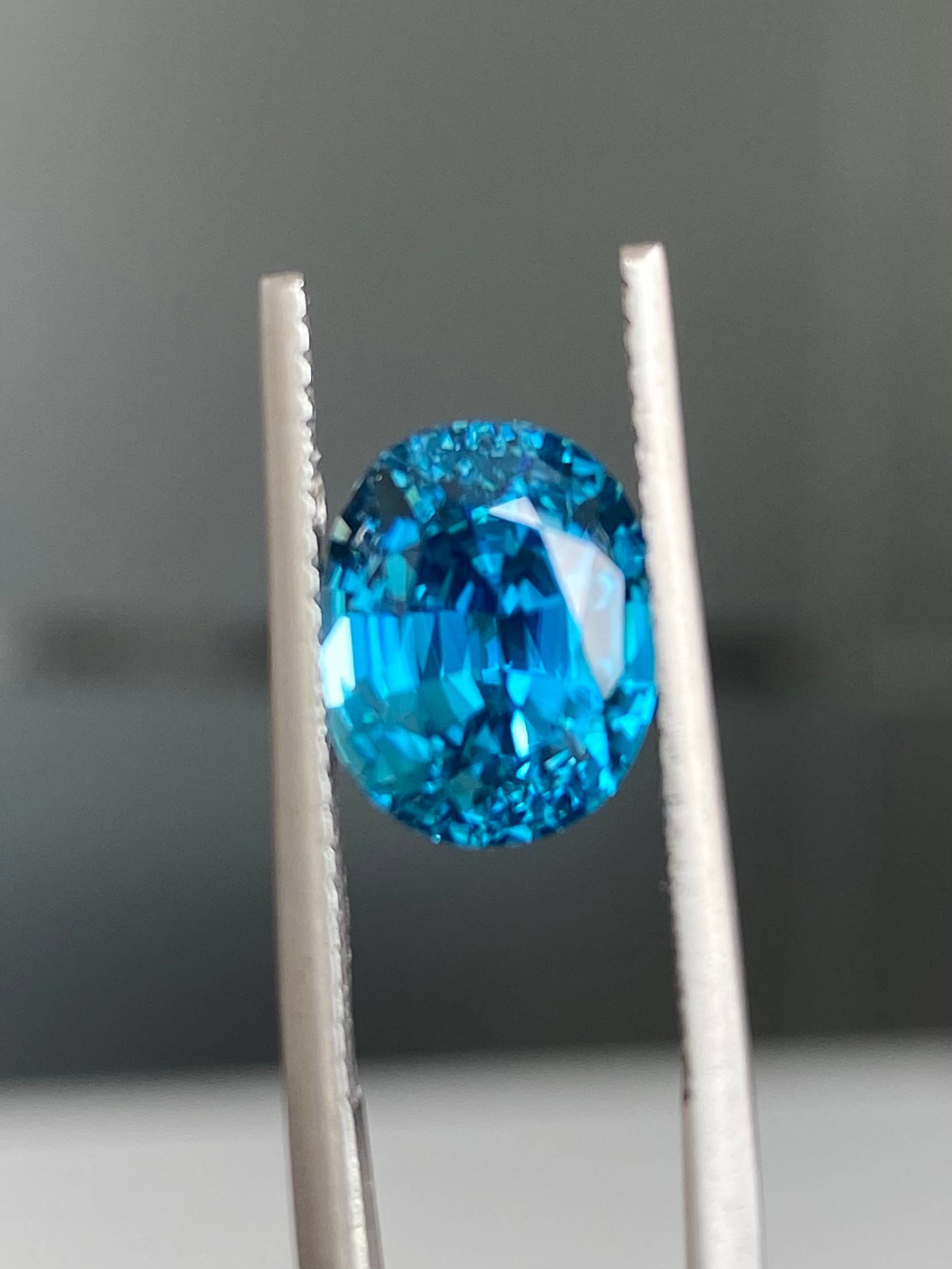 blue blue zircon, 5.21ct oval cut — view 5
