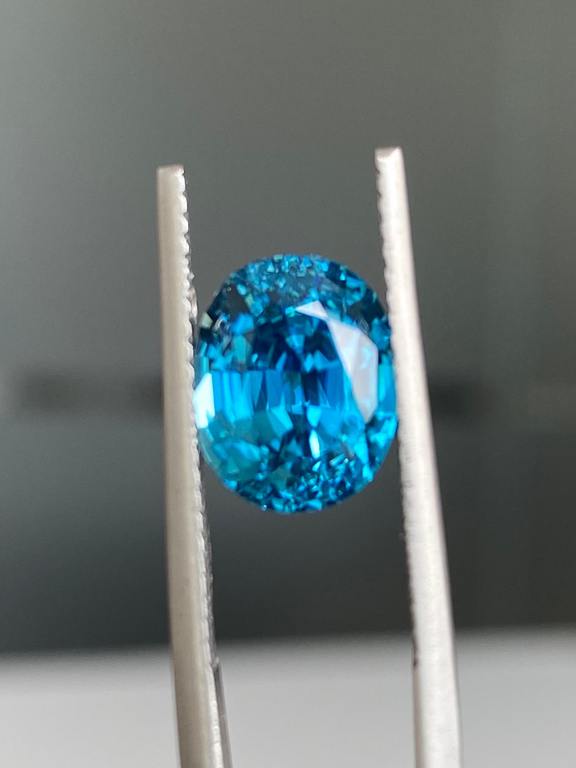 blue blue zircon, 5.21ct oval cut — view 5