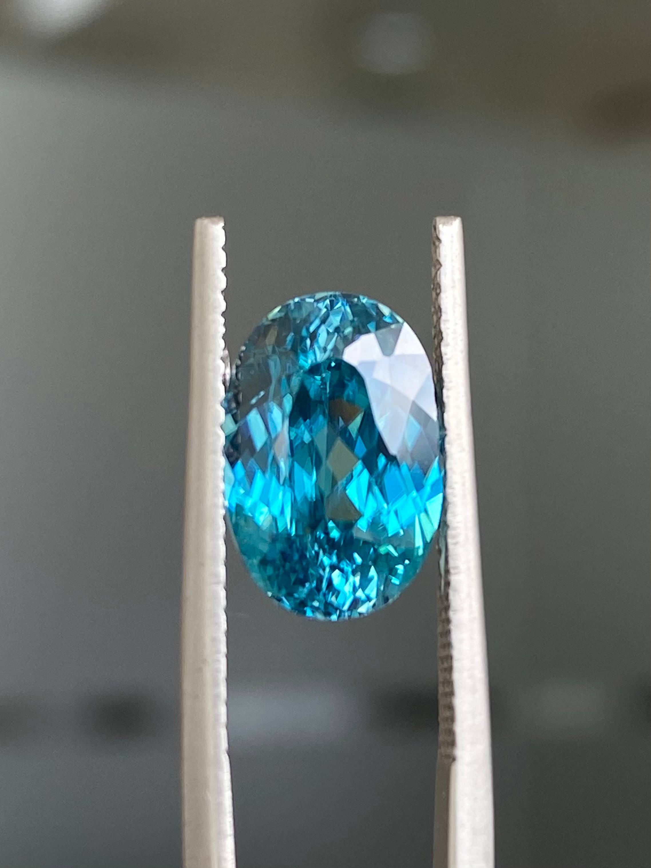 blue blue zircon, 7.01ct oval cut — view 5